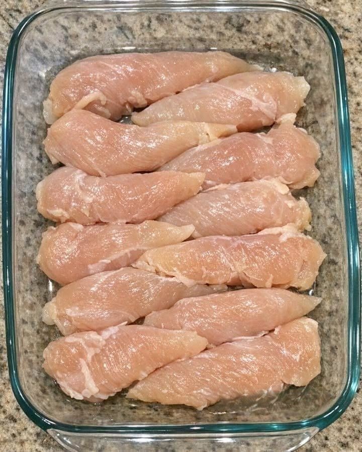 Throw raw chicken tenderloins in the glass casserole dish and 4 simple ingredients to get a meal so delicious your whole family will be begging for more.
